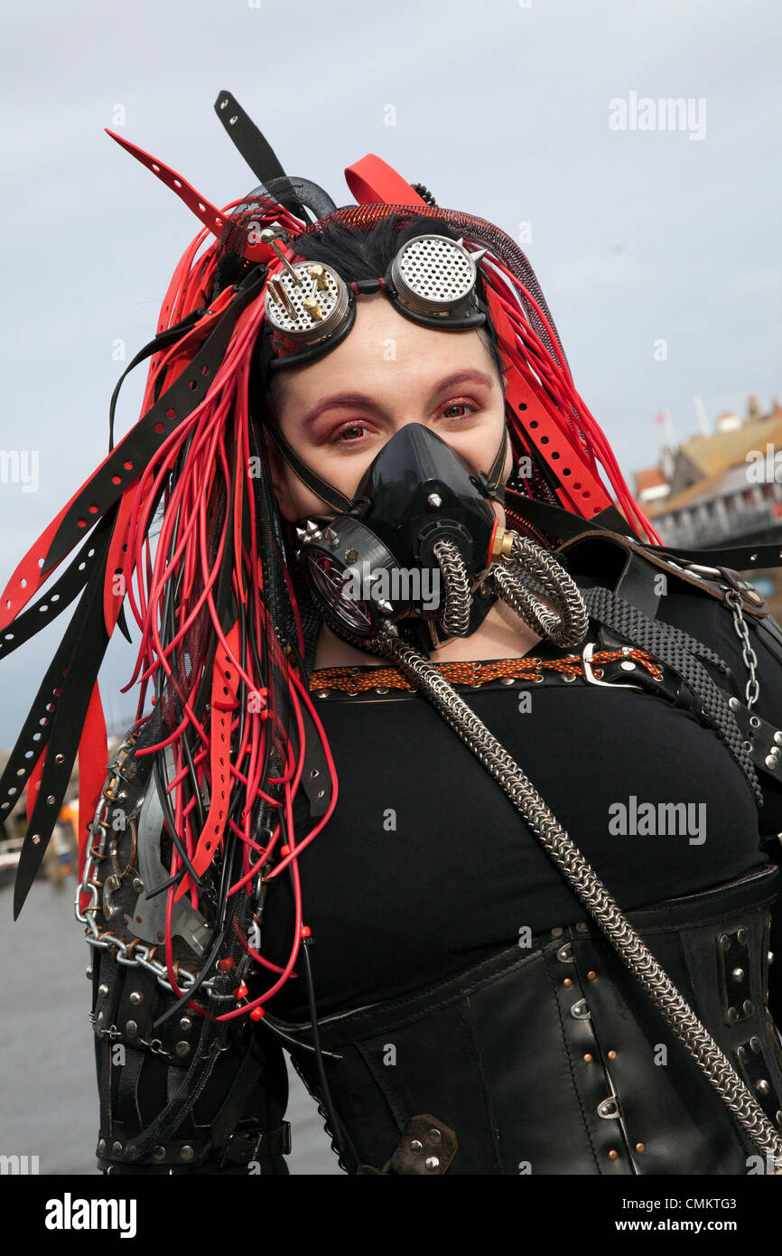 Lisa Rocknall 39, a CYBER goggles at the  UK'S Biggest Goth & Alternative Weekend. Whitby. Goths, romantics and macabre fans travelled over the moors for the Whitby Goth Weekend, which has become their spiritual home. As well as Goths, there are Punks, Steampunks, Emos, Bikers, Metallers and all manner of weird and wonderful characters, The Halloween Special was founded by Jo Hampshire in 1994, this twice-yearly event now held in Spring and late Autumn. Stock Photo