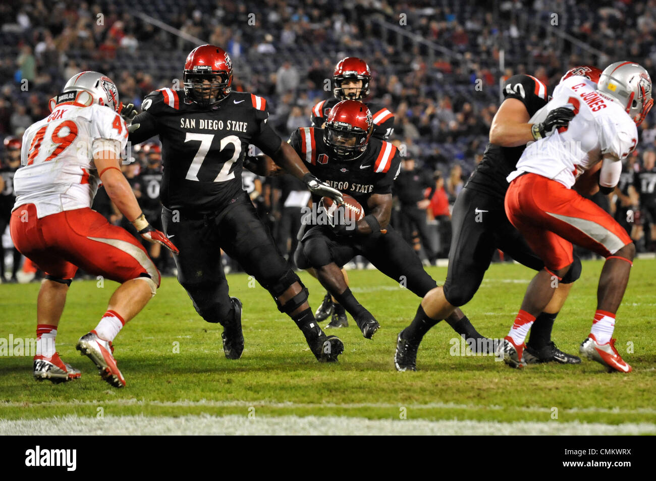 Nov. 2, 2013 - San Diego, CA, United States of America - San Diego State  Aztecs offensive linesman Daniel Brunskill (89) assists San Diego State  Aztecs running back Adam Muema (4) in