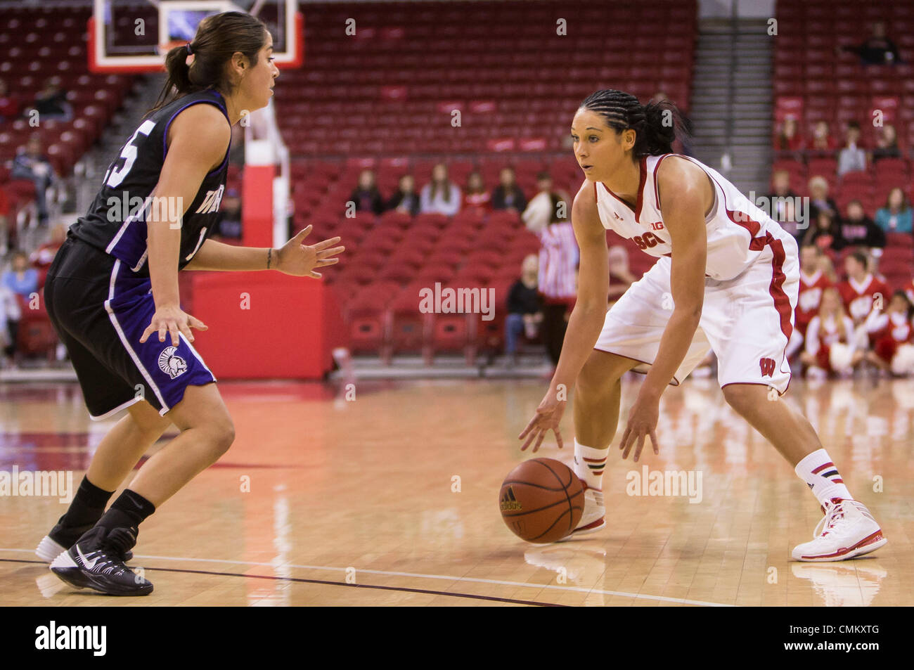 Madison, Wisconsin, USA. 3rd Nov, 2013. November 3, 2013: Wisconsin Badgers guard Taylor Wurtz #2 dribbles out top of the three point line during the NCAA Exhibition Basketball game between Winona State Warriors and the Wisconsin Badgers. The Badgers defeated the Warriors 80-49 at the Kohl Center in Madison, WI. John Fisher/CSM/Alamy Live News Stock Photo