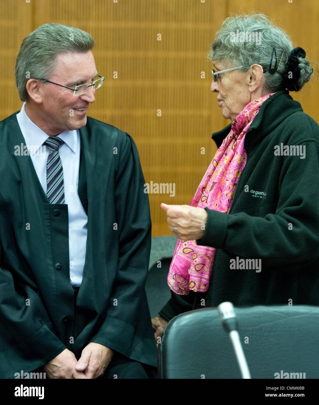 Frankfurt Main, Germany. 05th Nov, 2013. Accused Sonja Suder talks to her lawyer in the high security court room of the district court in Frankfurt Main, Germany, 05 November 2013. Suder stands accused of a possible involvement in a terror attack on the OPEC headquarters in Vienna in 1975. Photo: BORIS ROESSLER/dpa/Alamy Live News Stock Photo
