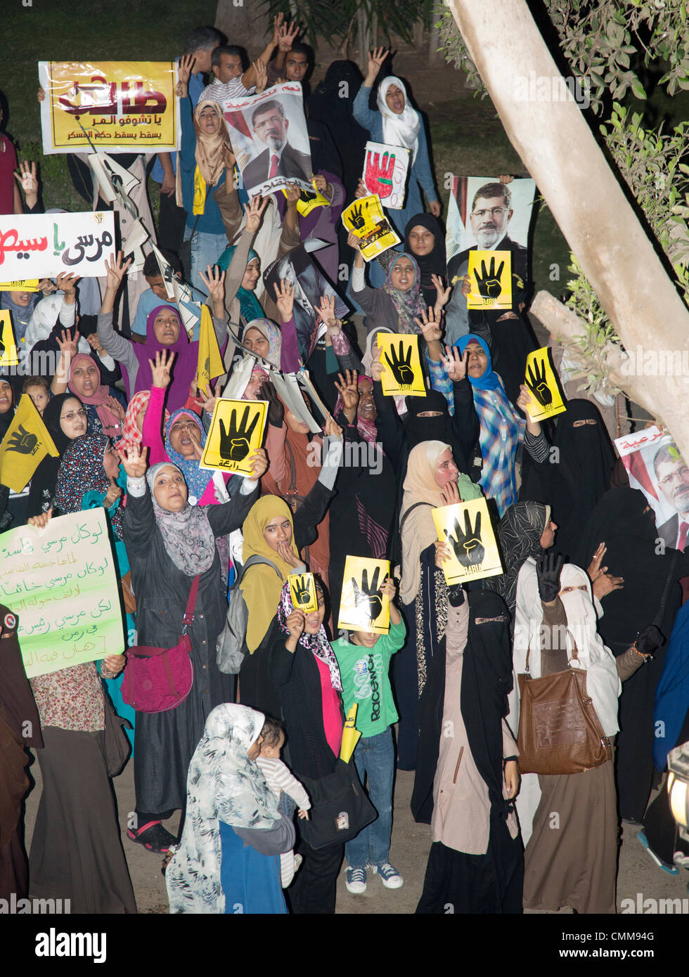 Cairo, Egypt . 05th Nov, 2013. men and veiled women demonstrate their support for deposed Egyptian president by marching through the Cairo suburb of Maadi Credit:  B.O'Kane/Alamy Live News Stock Photo