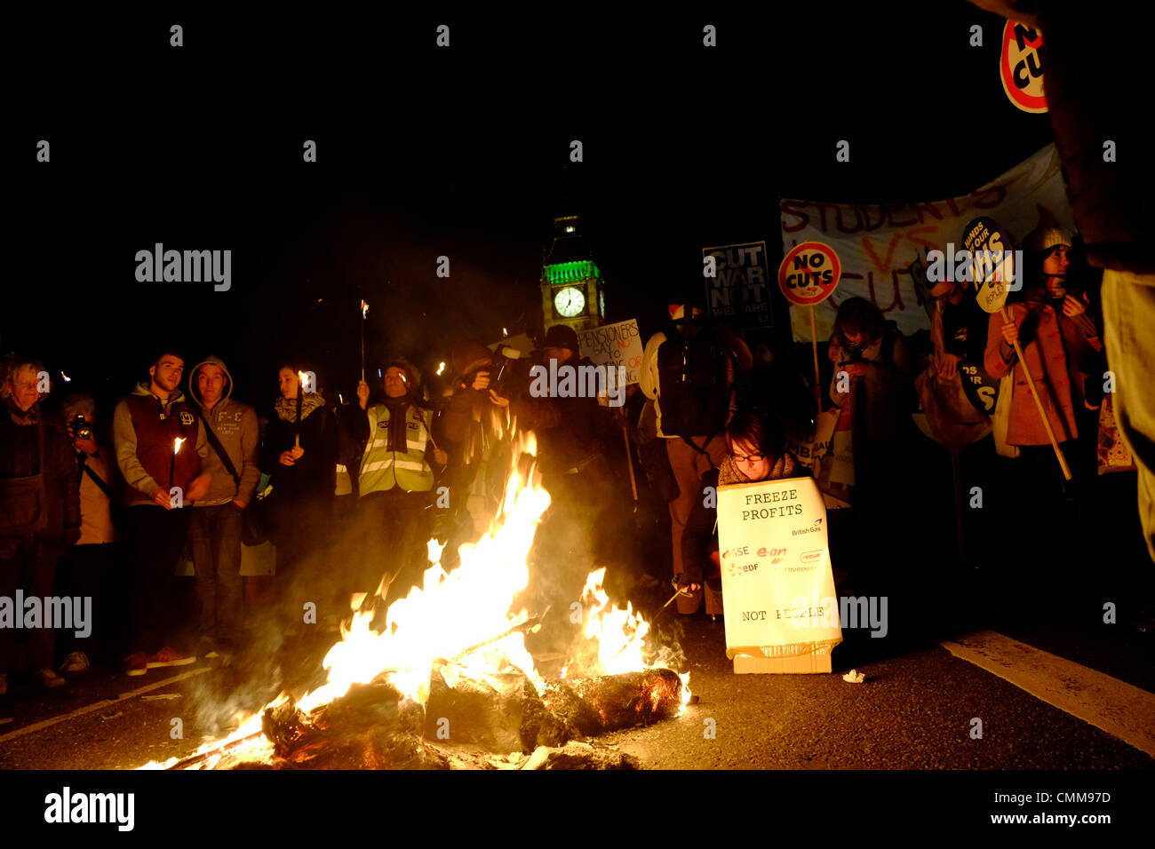 London, UK . 05th Nov, 2013. Protesters hold bonfire on Westminster bridge in front of parliament , burning fuel bills in protest against price rises and cuts. Credit:  Rachel Megawhat/17�Թ����� Live News Stock Photo