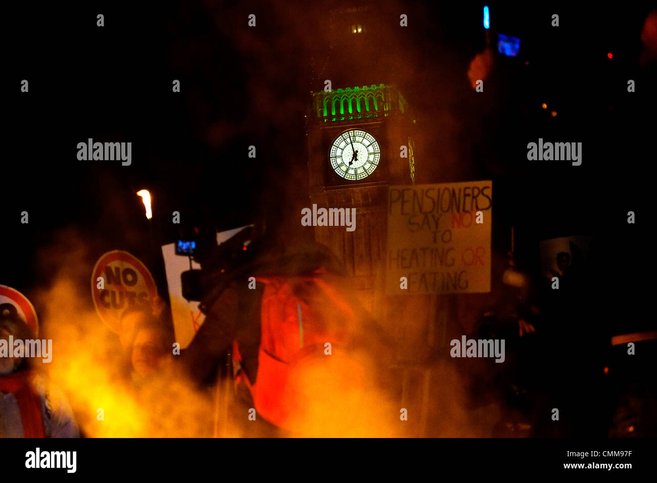 London, UK . 05th Nov, 2013. Protesters hold bonfire on Westminster bridge in front of parliament , burning fuel bills in protest against price rises and cuts. Credit:  Rachel Megawhat/17�Թ����� Live News Stock Photo