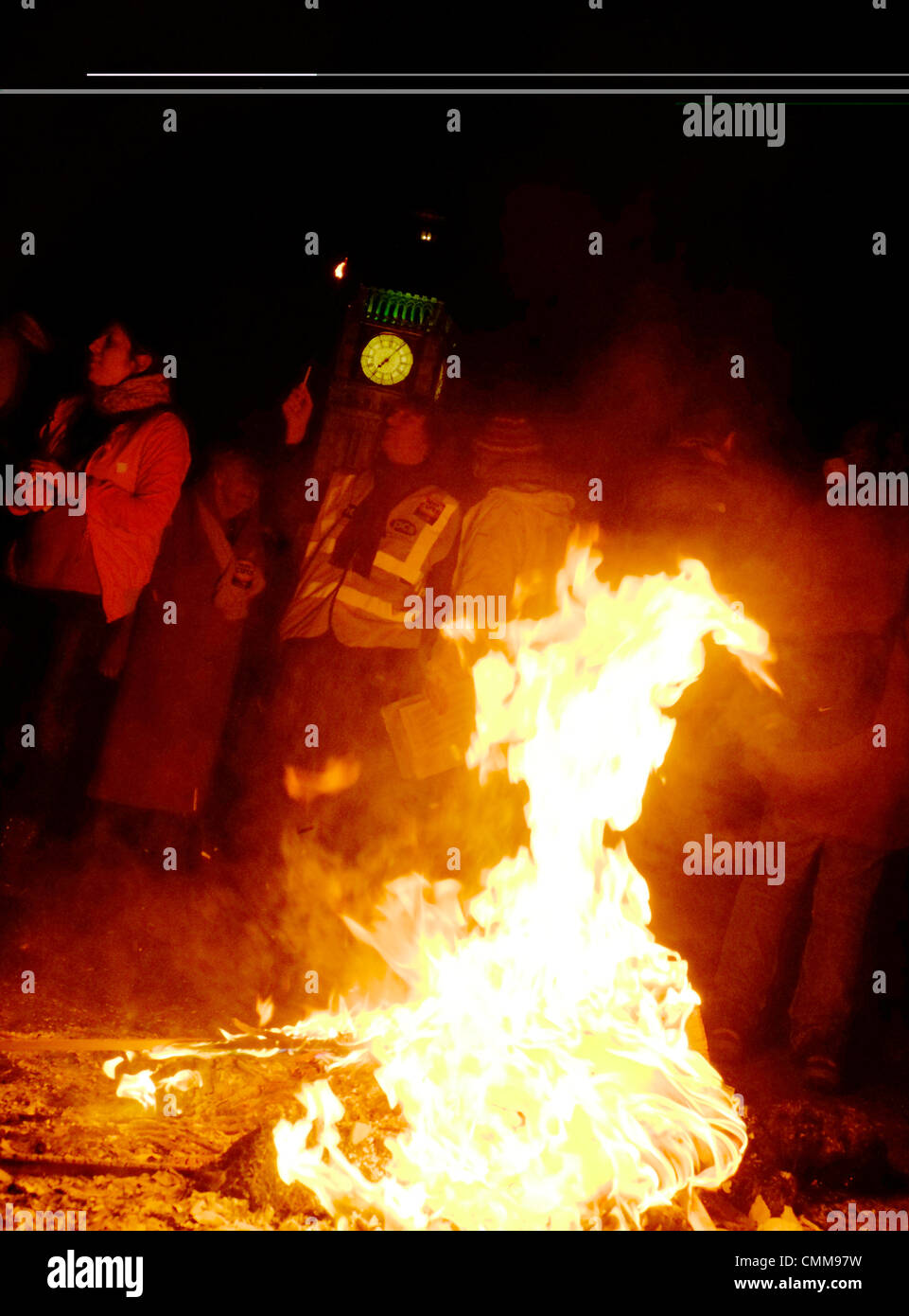 London, UK . 05th Nov, 2013. Protesters hold bonfire on Westminster bridge in front of parliament , burning fuel bills in protest against price rises and cuts. Credit:  Rachel Megawhat/17�Թ����� Live News Stock Photo