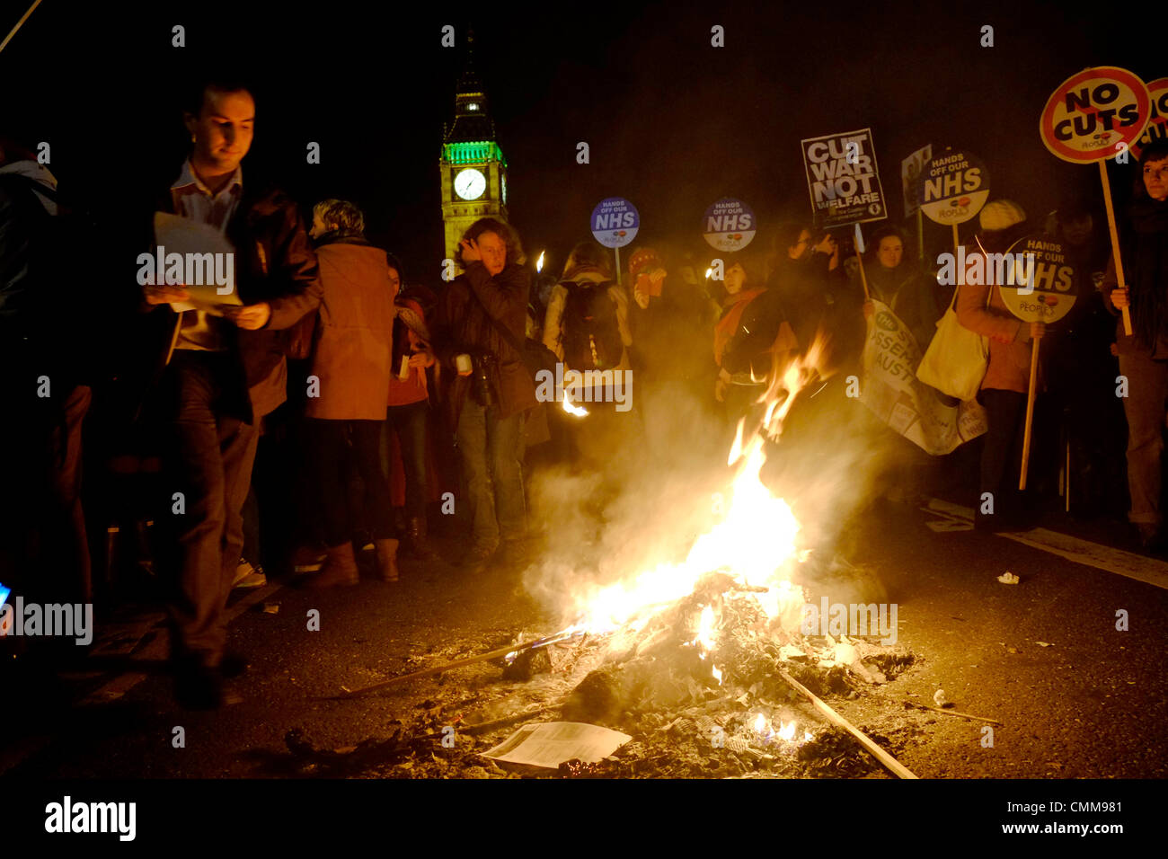 London, UK . 05th Nov, 2013. Protesters hold bonfire on Westminster bridge in front of parliament , burning fuel bills in protest against price rises and cuts. Credit:  Rachel Megawhat/17�Թ����� Live News Stock Photo