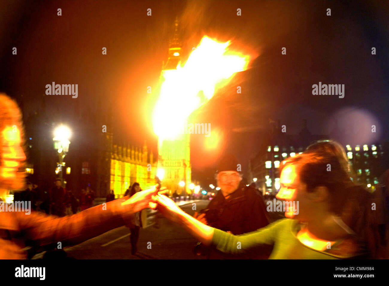 London, UK . 05th Nov, 2013. Protesters hold bonfire on Westminster bridge in front of parliament , burning fuel bills in protest against price rises and cuts. Credit:  Rachel Megawhat/17�Թ����� Live News Stock Photo