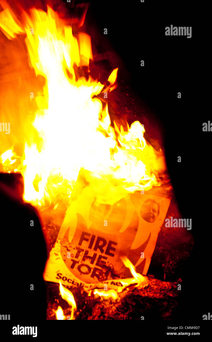 London, UK . 05th Nov, 2013.  A poster reading 'fire the Tories' burns on an 'austerity bonfire' on Westminster Bridge on November 5th Credit:  Andy Thornley/Alamy Live News Stock Photo