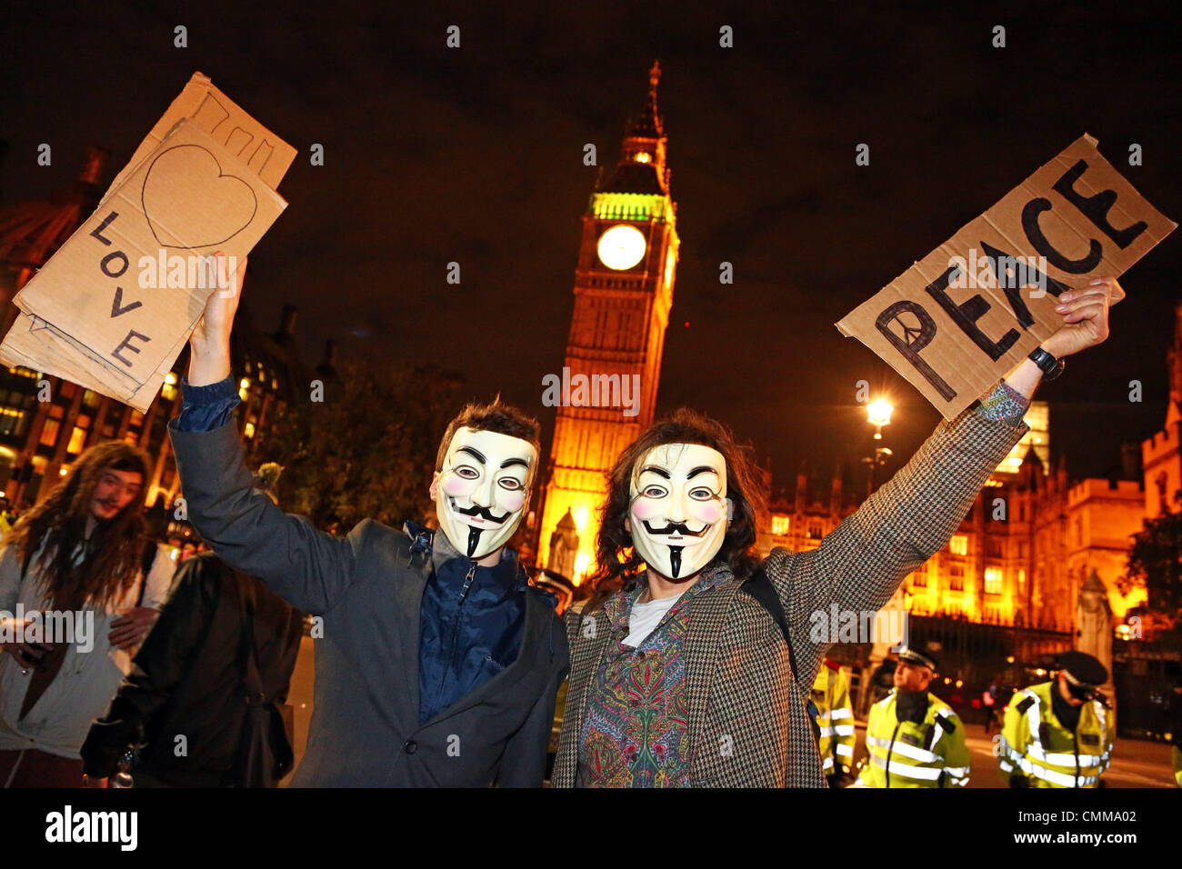 London, UK. 5th November 2013. Protestors wearing Anonymous masks in front of the Houses of Parliament at the 5th November protests in Parliament Square including OpVendetta by Anonymous UK, anti-government cuts protestors and anti-badger culling demonstrations, London, England Credit:  Paul Brown/Alamy Live News Stock Photo