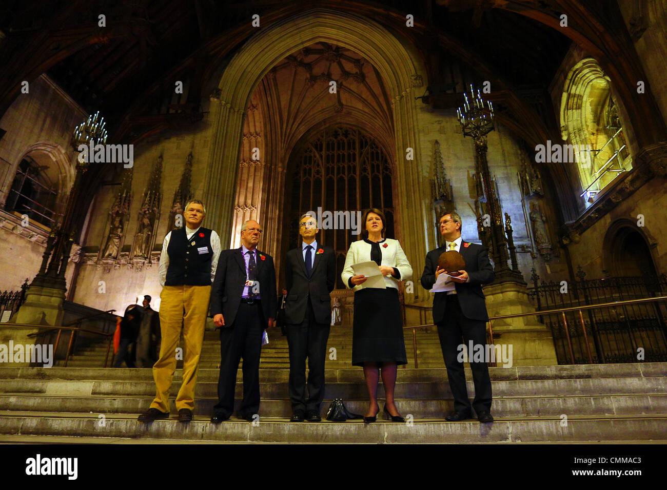 London, UK. 5th November 2013. Photographer Mike St. Maur Sheil, Lord Faulkner of Worcester, Dr. Andrew Murrison MP, Rt Hon Maria Miller MP - Secretary of State for Culture, Media and Sport and the Rt Hon Jeffrey Donaldson MP at the Fields of Battle Lands of Peace 14-18 pre-launch exhibition at Westminster Hall, Houses of Parliament, London. Announcing a major commemorative WWI exhibition by World Press Photo Award-winning photographer Mike St. Maur Sheil which will launch in London in 2014 and tour English towns for the next four years. Credit:  Paul Brown/Alamy Live News Stock Photo