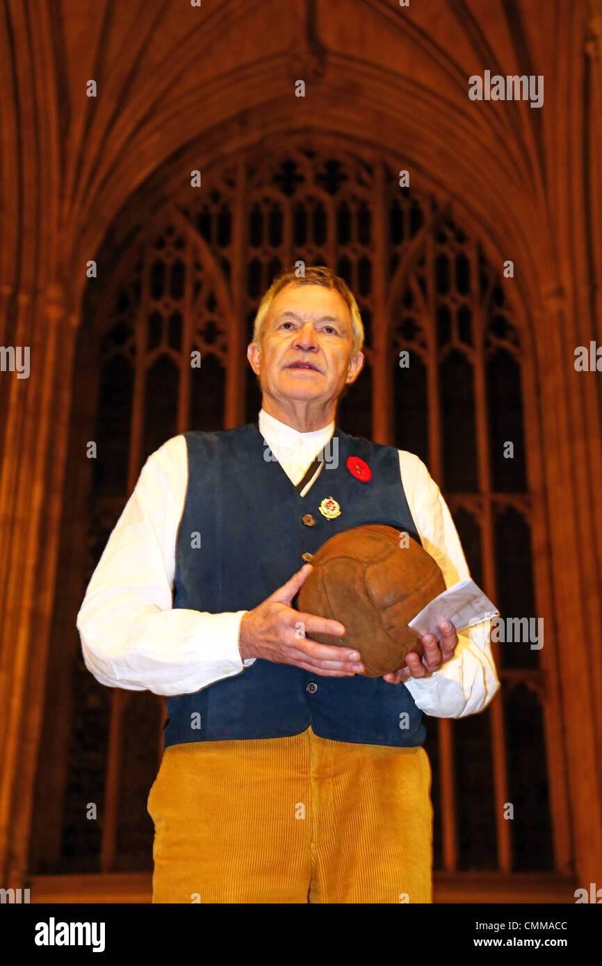 London, UK. 5th November 2013. Photographer Mike St. Maur Sheil with the Loos Football (This is the football which the London Irish Rifles kicked across No Mans Land on Sept 25th 1915 as they attacked the German positions in the town of Loos) at the Fields of Battle Lands of Peace 14-18 pre-launch exhibition at Westminster Hall, Houses of Parliament, London. Announcing a major commemorative WWI exhibition by World Press Photo Award-winning photographer Mike St. Maur Sheil which will launch in London in 2014 and tour English towns for the next four years. Credit:  Paul Brown/Alamy Live News Stock Photo