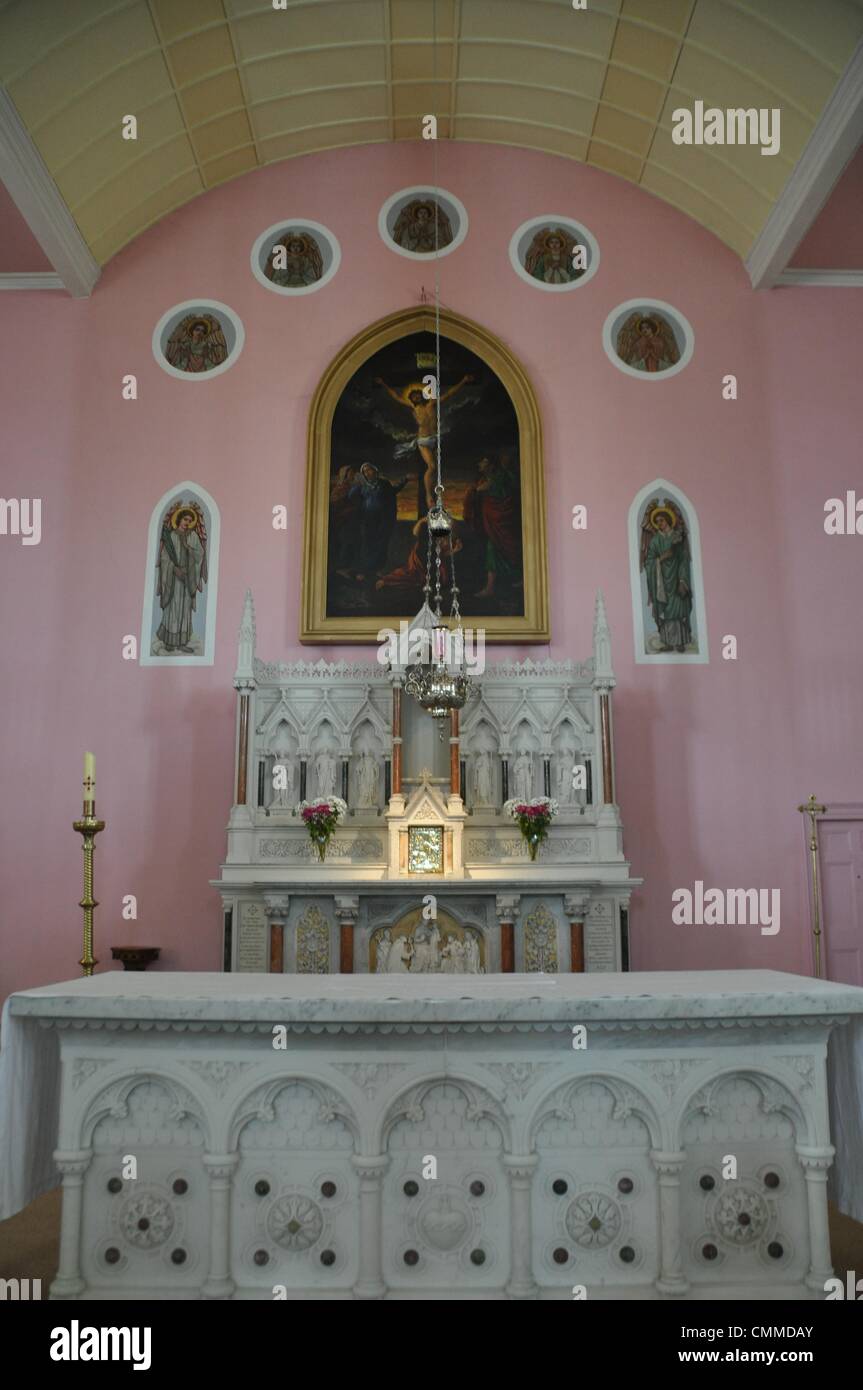 The Parish Church of St. Mary in Youghal (co. Cork) built in 1796 is an unusual looking church, photo taken may 23, 2013. The wall behind the altar is coloured pink and the organ opposite the altar is resplendent in pink and violet. Photo: Frank Baumgart Stock Photo
