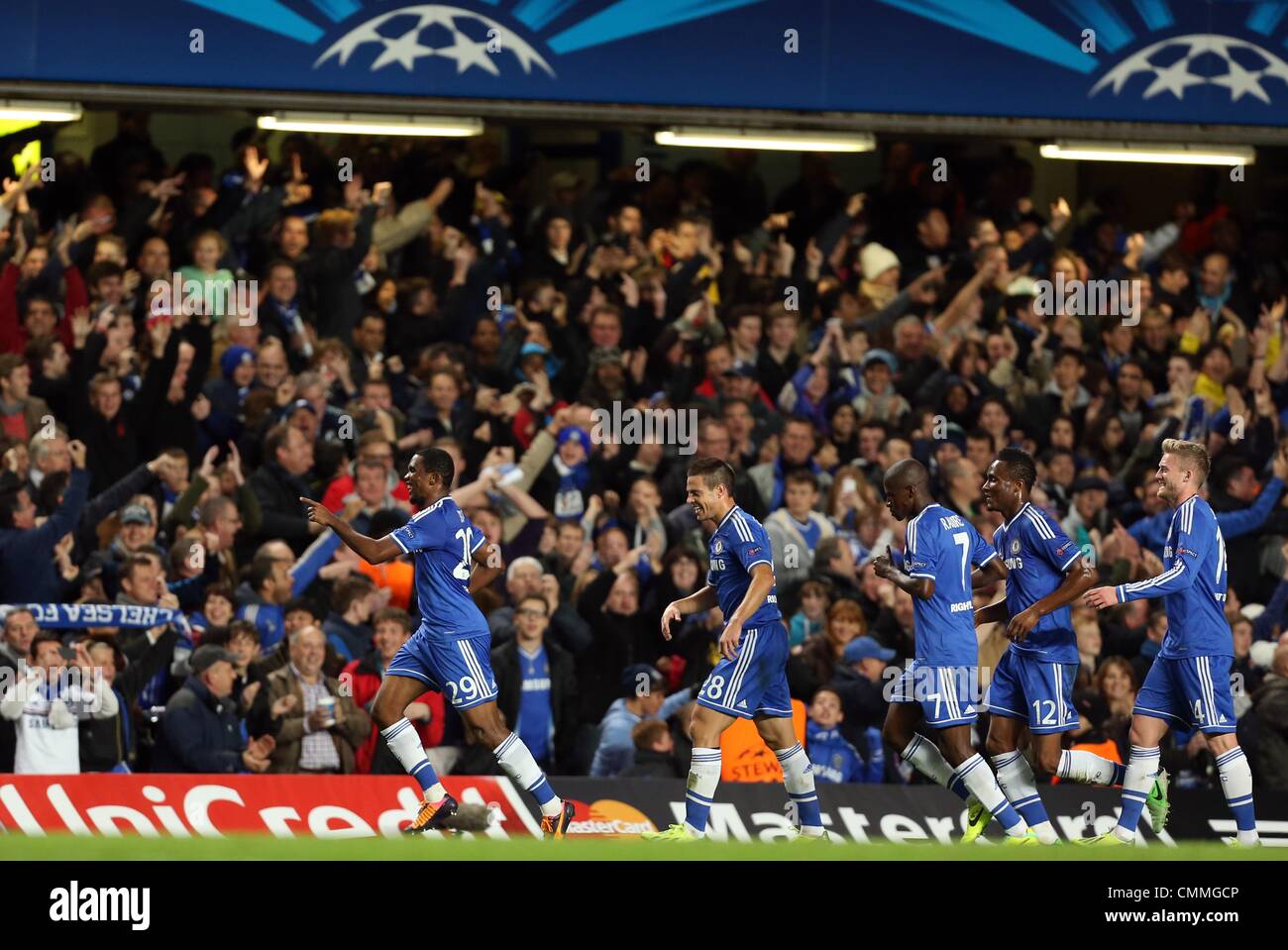 London, Britain. 06th Nov, 2013. Samuel Eto'o (L) of Chelsea celebrates his goal for 1-0 during the UEFA Champions League group E soccer match between Chelsea FC and FC Schalke 04 at Stamford Bridge Stadium in London, Britain, 06 November 2013. Photo: Friso Gentsch/dpa/Alamy Live News Stock Photo
