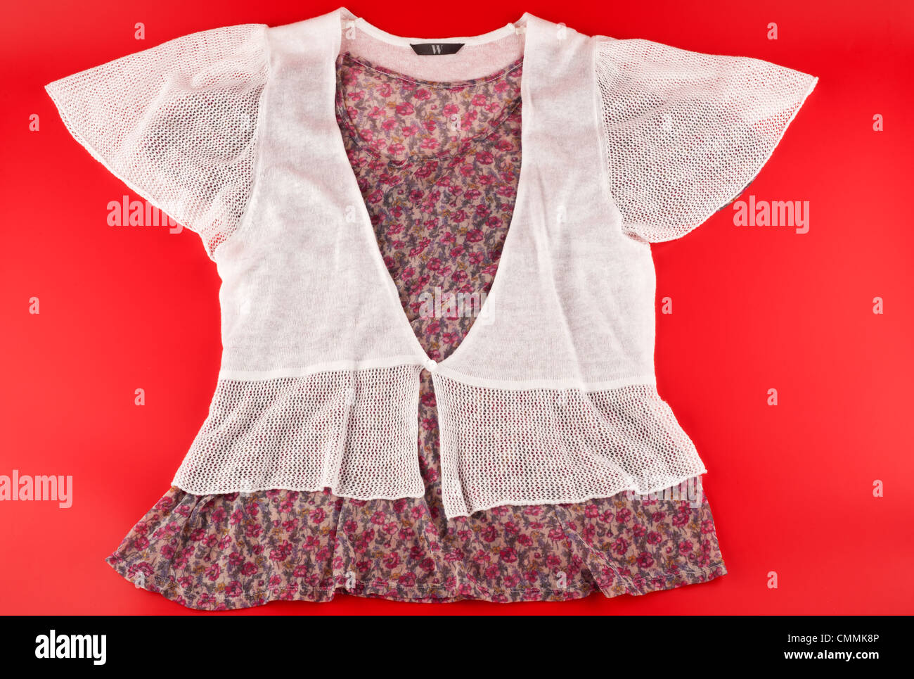 ladies pink floral blouse white short sleeved cardigan Stock Photo