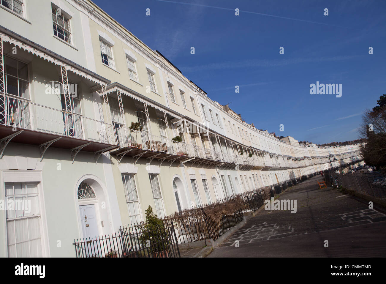 The Grade II listed row of terraced housing on the Royal York Crescent in Clifton, Bristol on a sunny day with a blue sky. Stock Photo