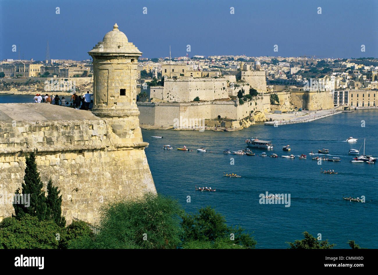 View over Bastions and Grand Harbour to Fort St. Angelo with Rowing Regatta, Valletta, Malta, Mediterranean, Europe Stock Photo