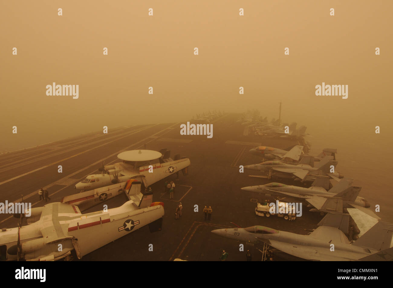 US Navy aircraft carrier USS Carl Vinson makes way in zero visibility in a sand storm March 19, 2012 in the Arabian Sea. Stock Photo