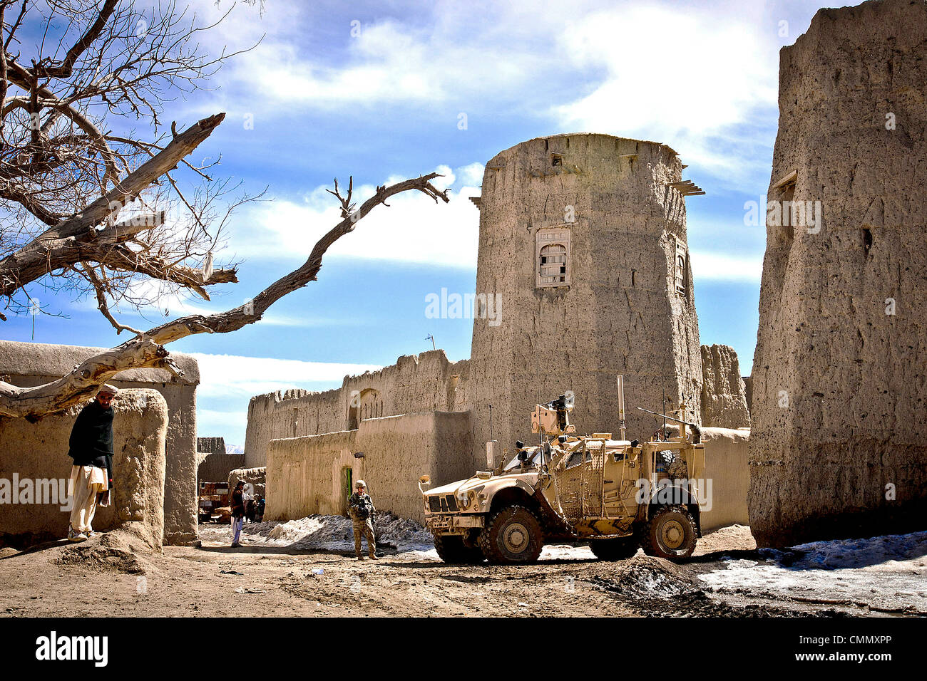 US Army soldiers cordon off the town square of a small village near Combat Outpost Yosef Khel March 9, 2012 in Patika, Afghanistan. The soldiers were assisting the Afghan Uniformed Police and Afghan National Army conduct traffic check points near the village. Stock Photo