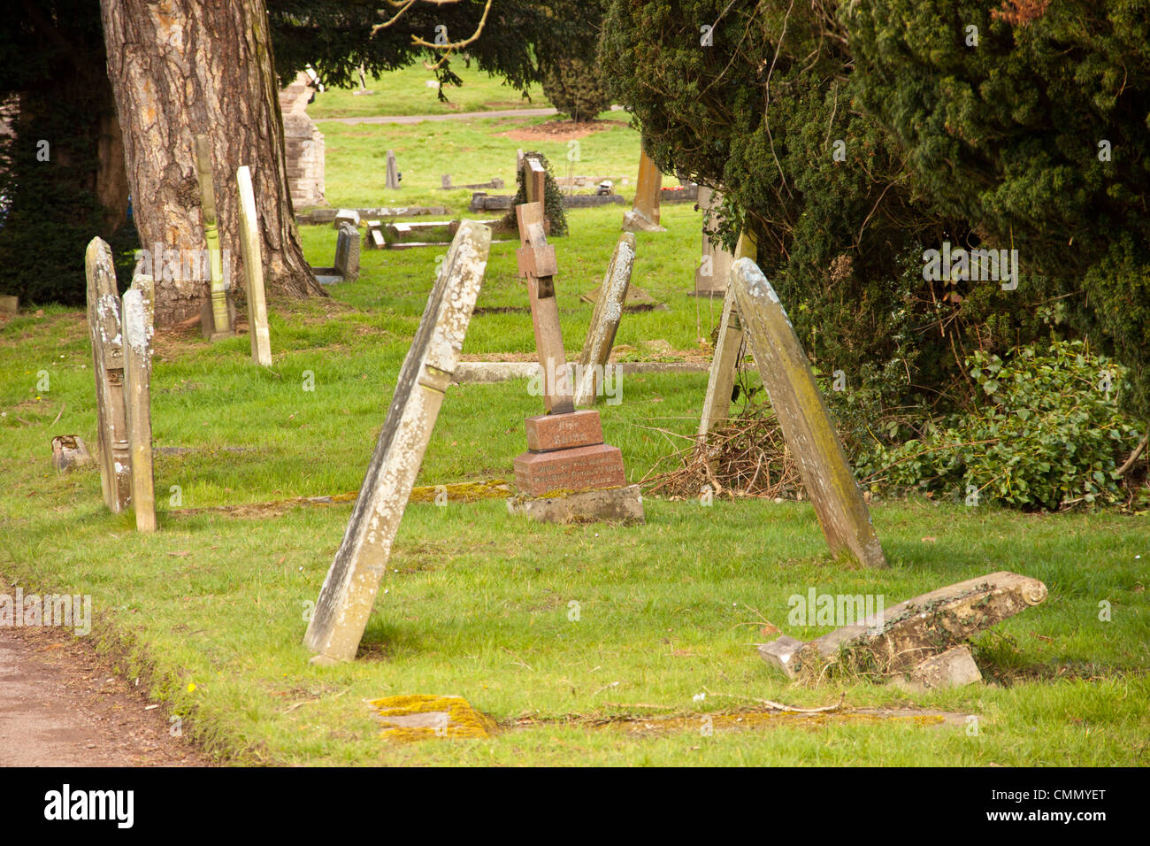 headstones,gravestones leaning and falling over in cemetery graveyard. Stock Photo