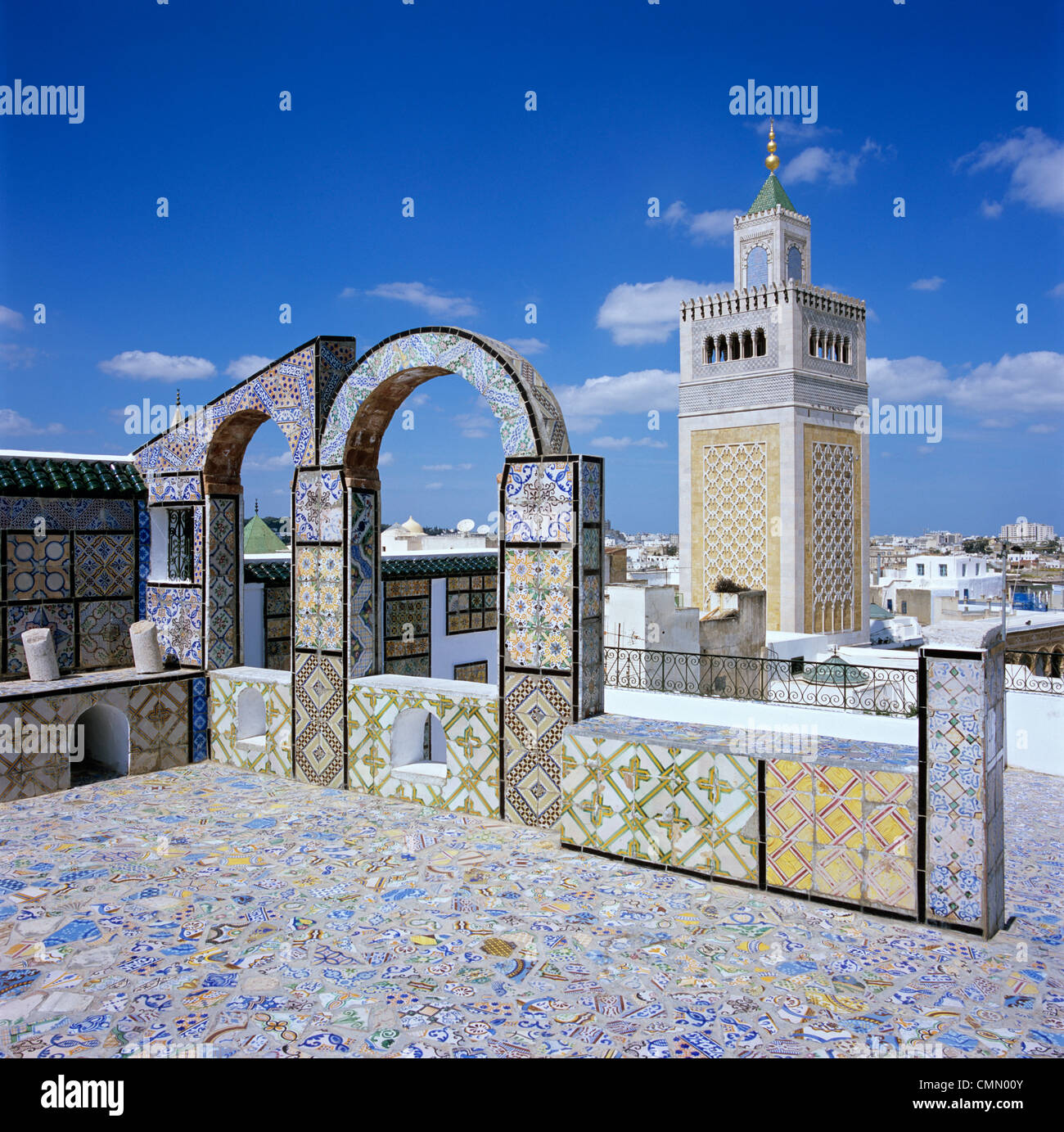 View over city and Great Mosque from tiled roof top, Tunis, Tunisia, North Africa, Africa Stock Photo