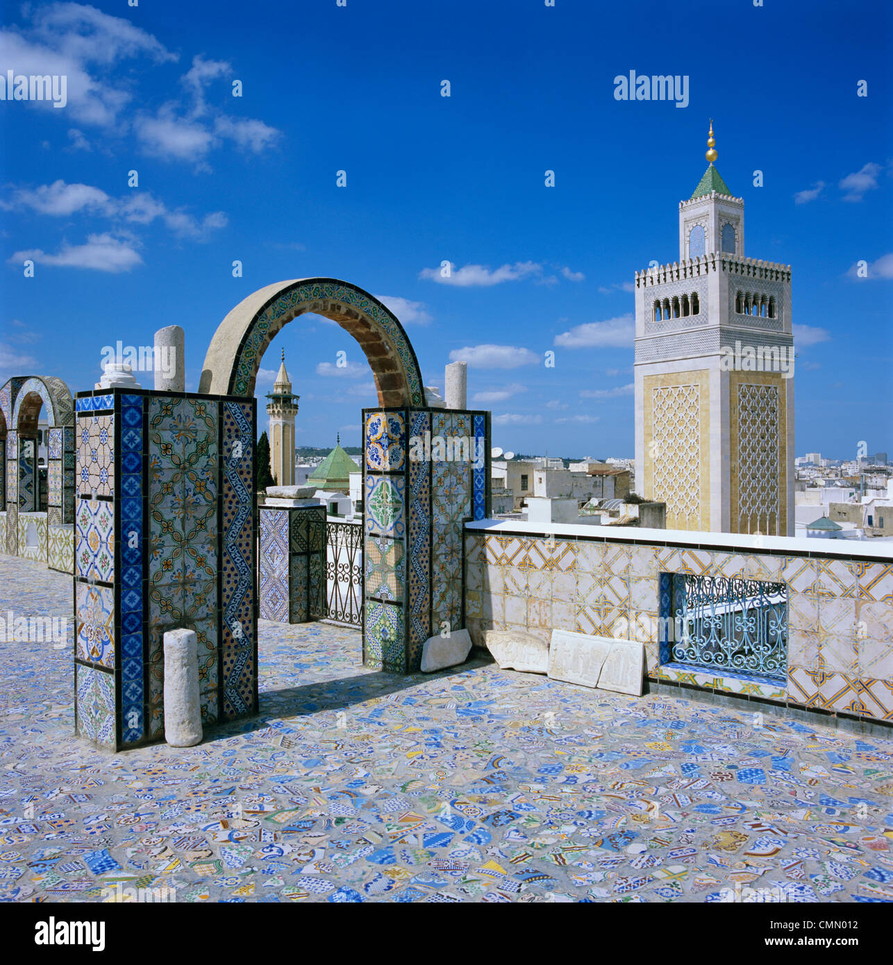 View over city and Great Mosque from tiled roof top, Tunis, Tunisia, North Africa, Africa Stock Photo