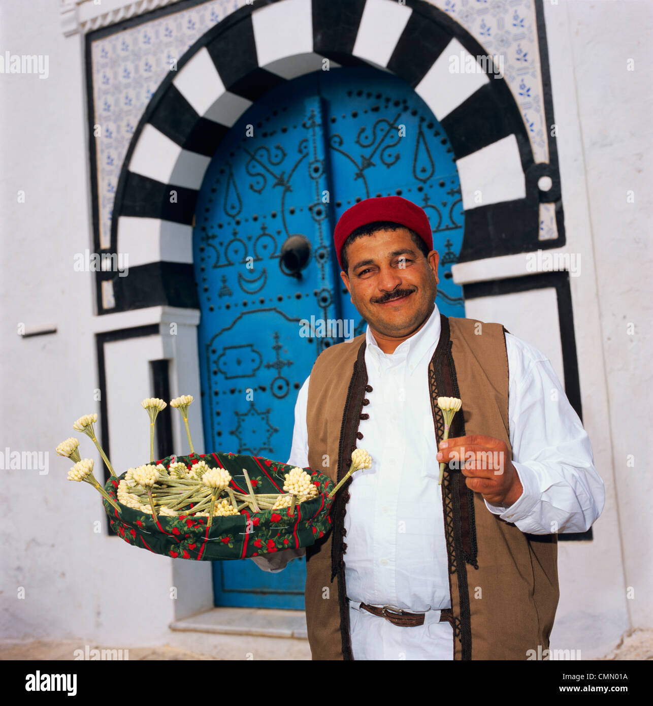 Jasmine seller in doorway, Sidi Bou Said, Tunisia, North Africa, Africa  Stock Photo - Alamy