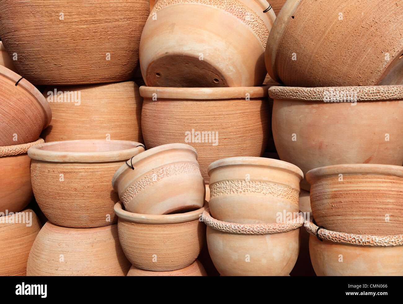 Stack of dumpy earthenware plant pots Stock Photo