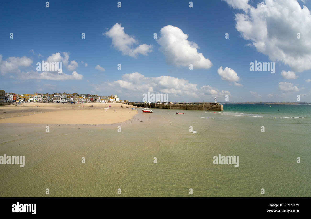 St. Ives harbour beach shallow water as the tide comes in. Stock Photo