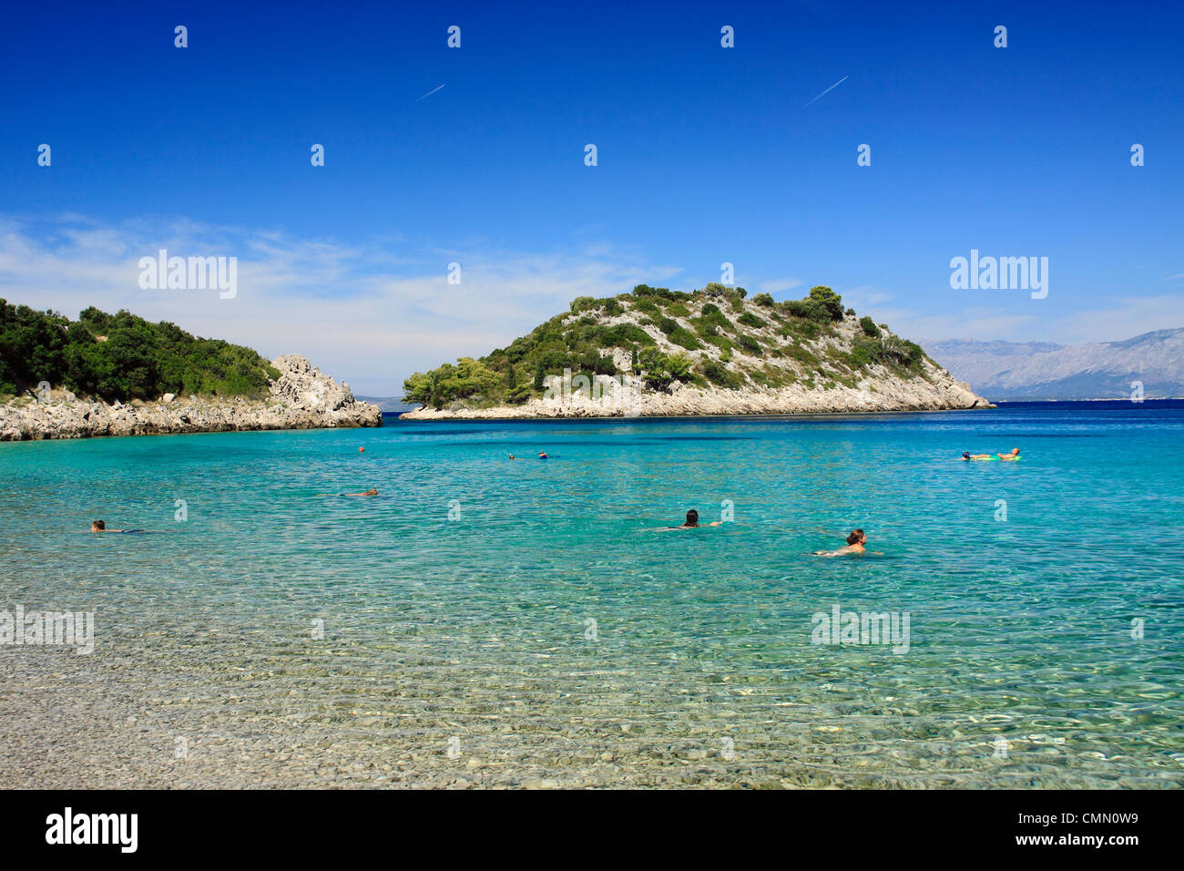 People swimming in Divna bay, Peljesac peninsula, Croatia Stock Photo