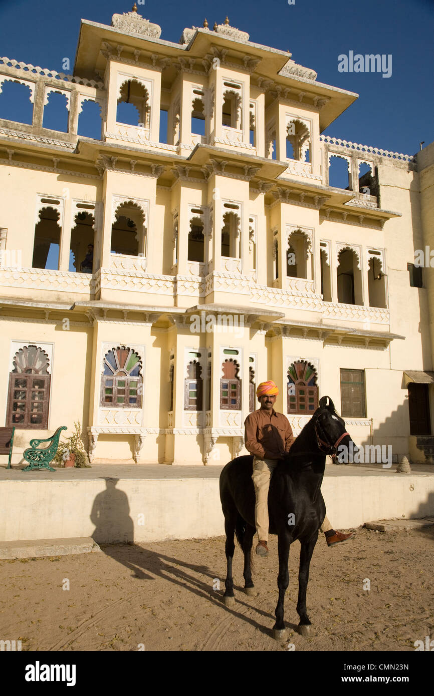 Hemant Deval on a Marwari horse in front of his family home Ravla Khempur Heritage Hotel near Udaipur, Rajasthan, India. Stock Photo