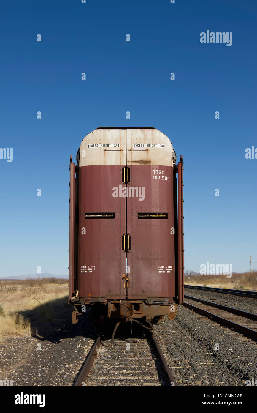 Railroad car designed to transport automobiles parked in rural west Texas. Stock Photo