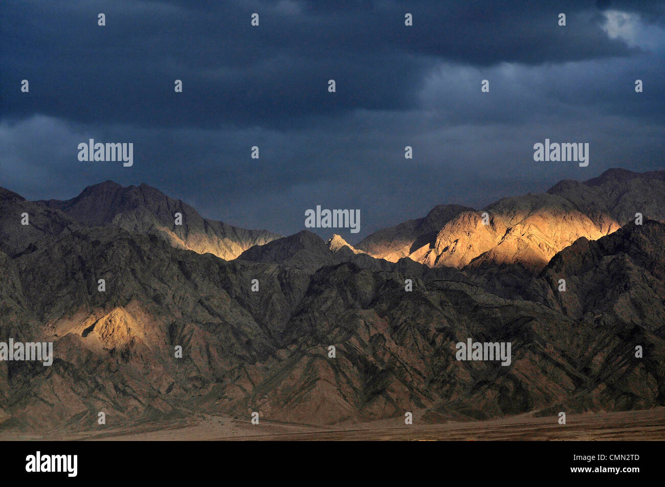 Desert mountain views of the Edom Mountains in Jordan at the edge of the Arabah valley. Seen from the Negev desert Israel. Stock Photo