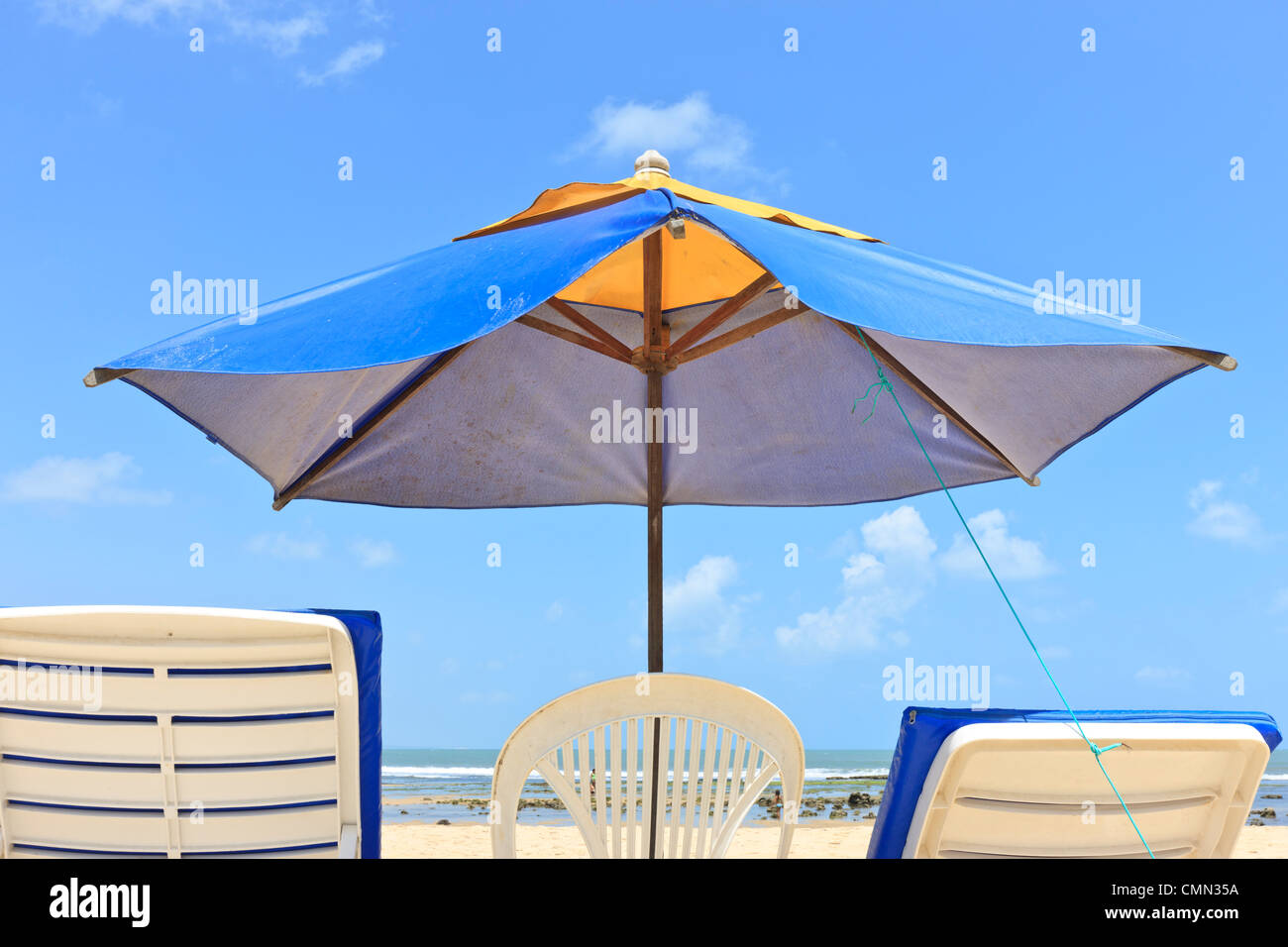 parasol, umbrella, sunshade, sun umbrella with beach chairs on beach, Brazil, Brasil Stock Photo