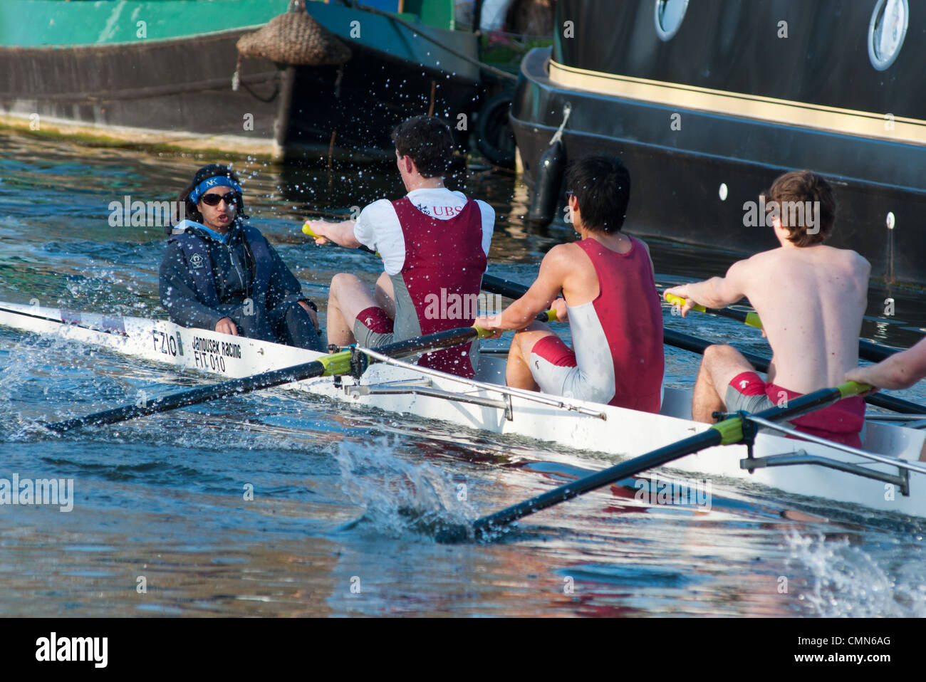 Rowers working hard on the river Cam at Cambridge, England Stock Photo