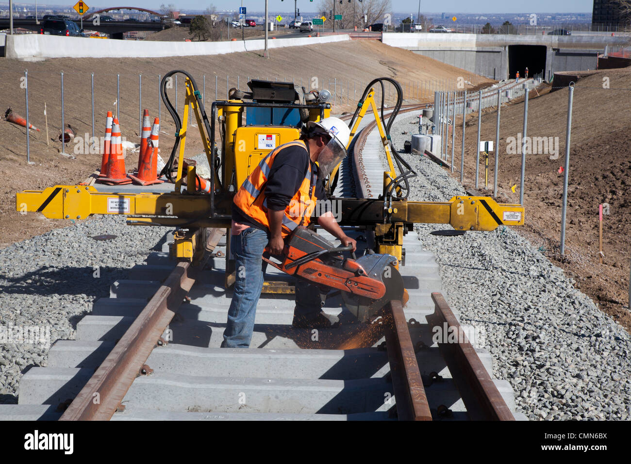 Lakewood, Colorado - Workers build a light rail urban transit system linking Denver with its western suburbs. Stock Photo