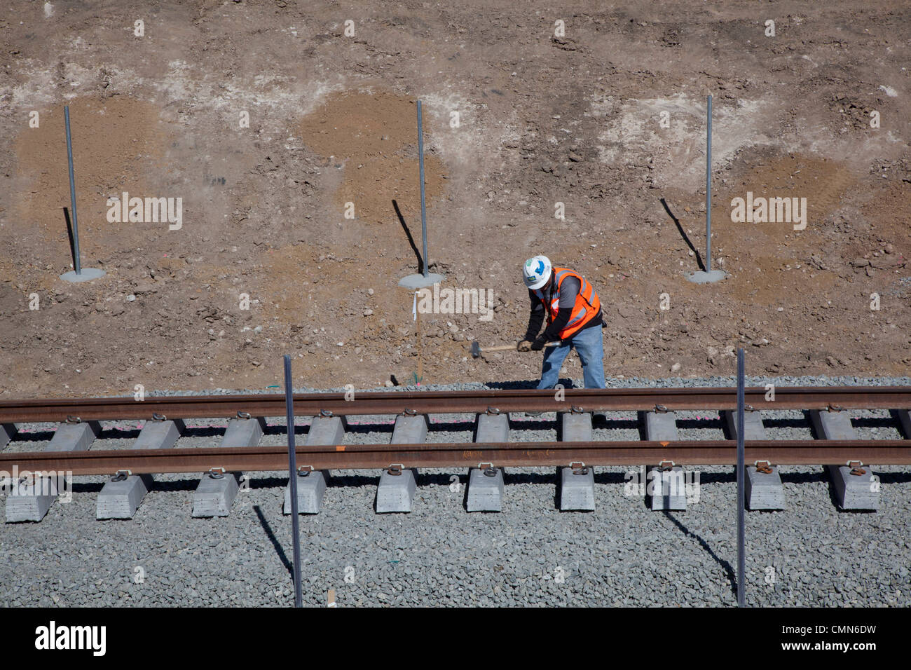 Lakewood, Colorado - Workers build a light rail urban transit system linking Denver with its western suburbs. Stock Photo