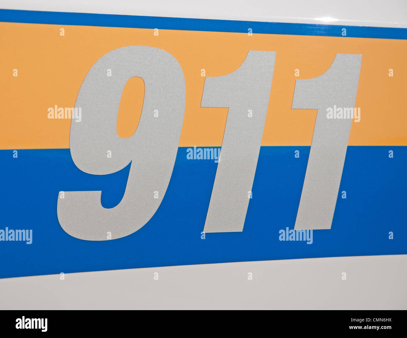 Reflective 911 -decal on side of a law enforcement vehicle Stock Photo