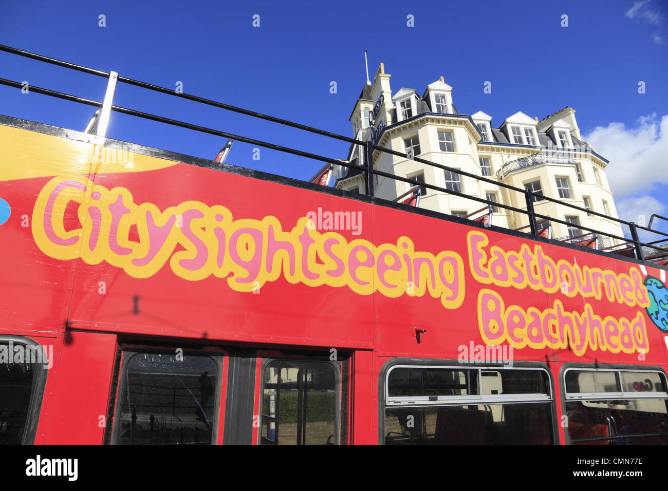 An open top bus tour on the seafront at  Eastbourne, East Sussex, England. Stock Photo