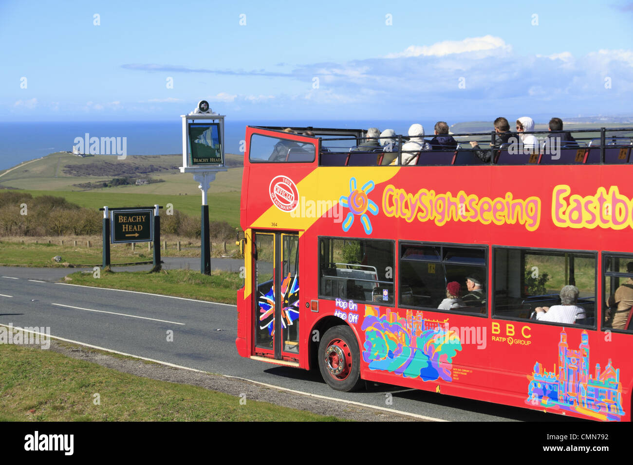An open top bus tour calls at Beachy Head on the South Downs National Park near Eastbourne, East Sussex, England. Stock Photo