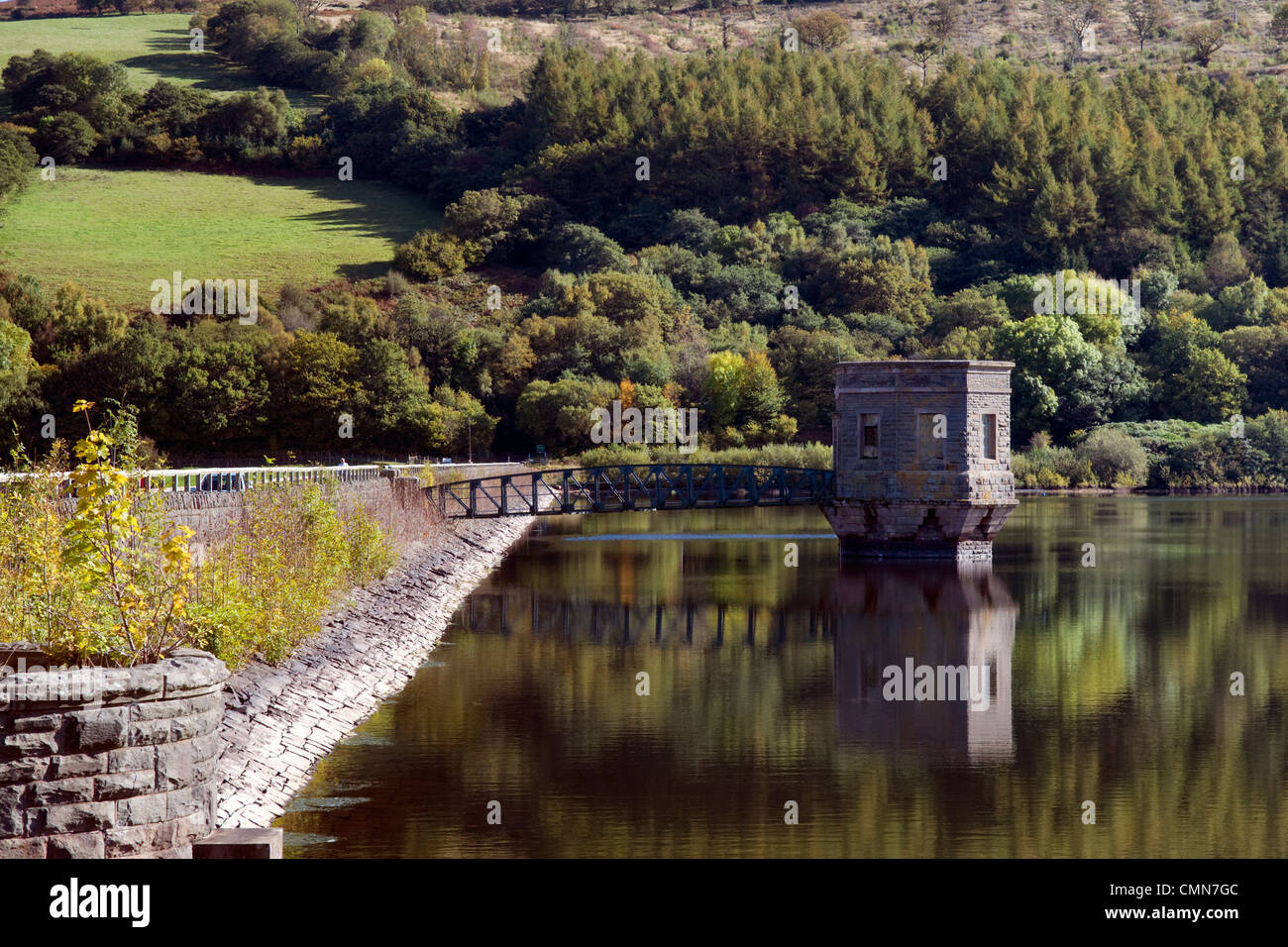 Talybont reservoir, dam and water tower with reflection at Brecon Beacons in Wales taken on beautiful bright sunny day Stock Photo