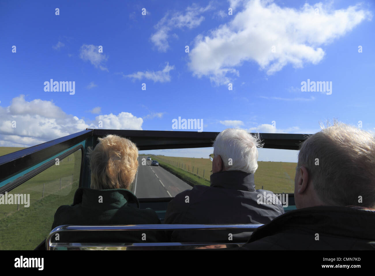 Tourists on an open top bus tour at Beachy Head on the South Downs National Park near Eastbourne, East Sussex, England. Stock Photo