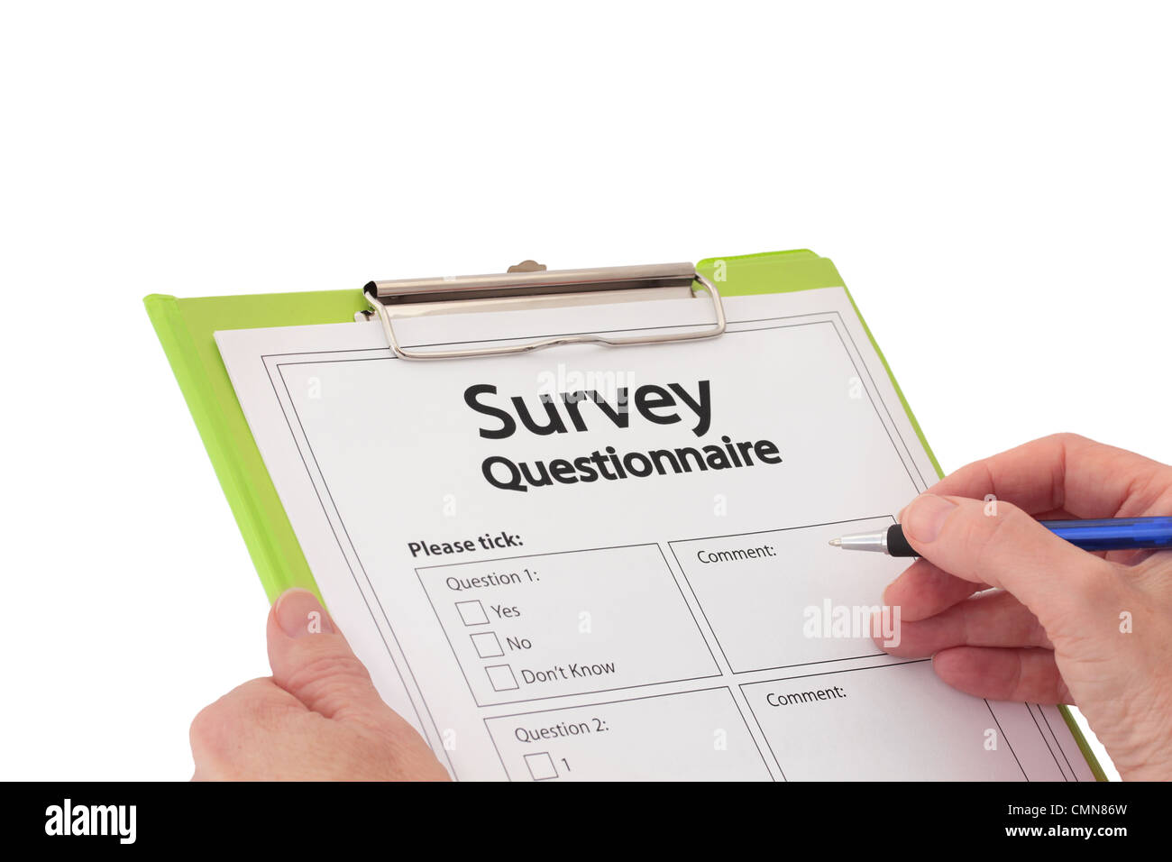 Hand with Pen Completing Market Research Survey Questionnaire Stock Photo