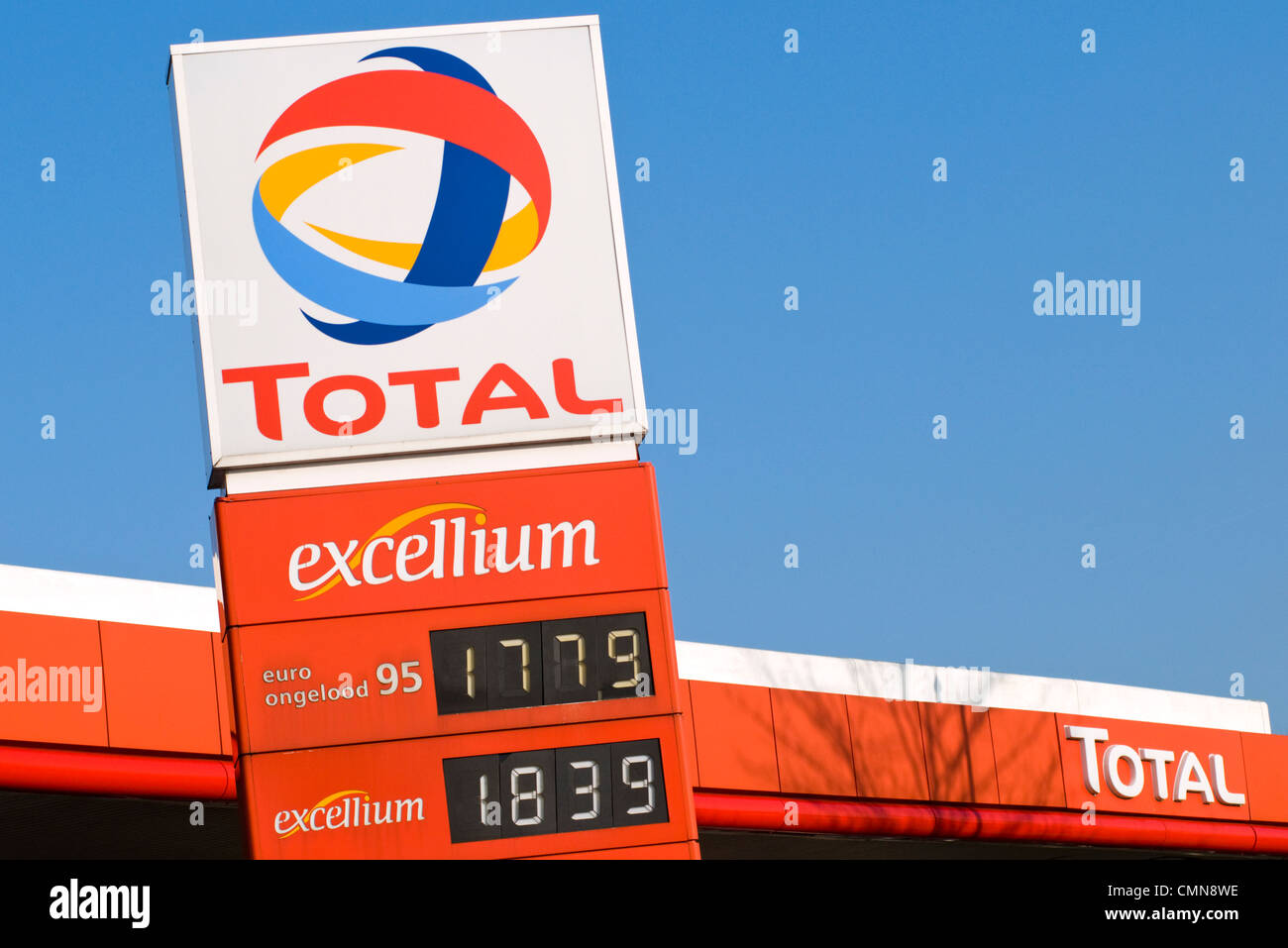 Prices on display on a sign outside a Total petrol station in the Netherlands Stock Photo