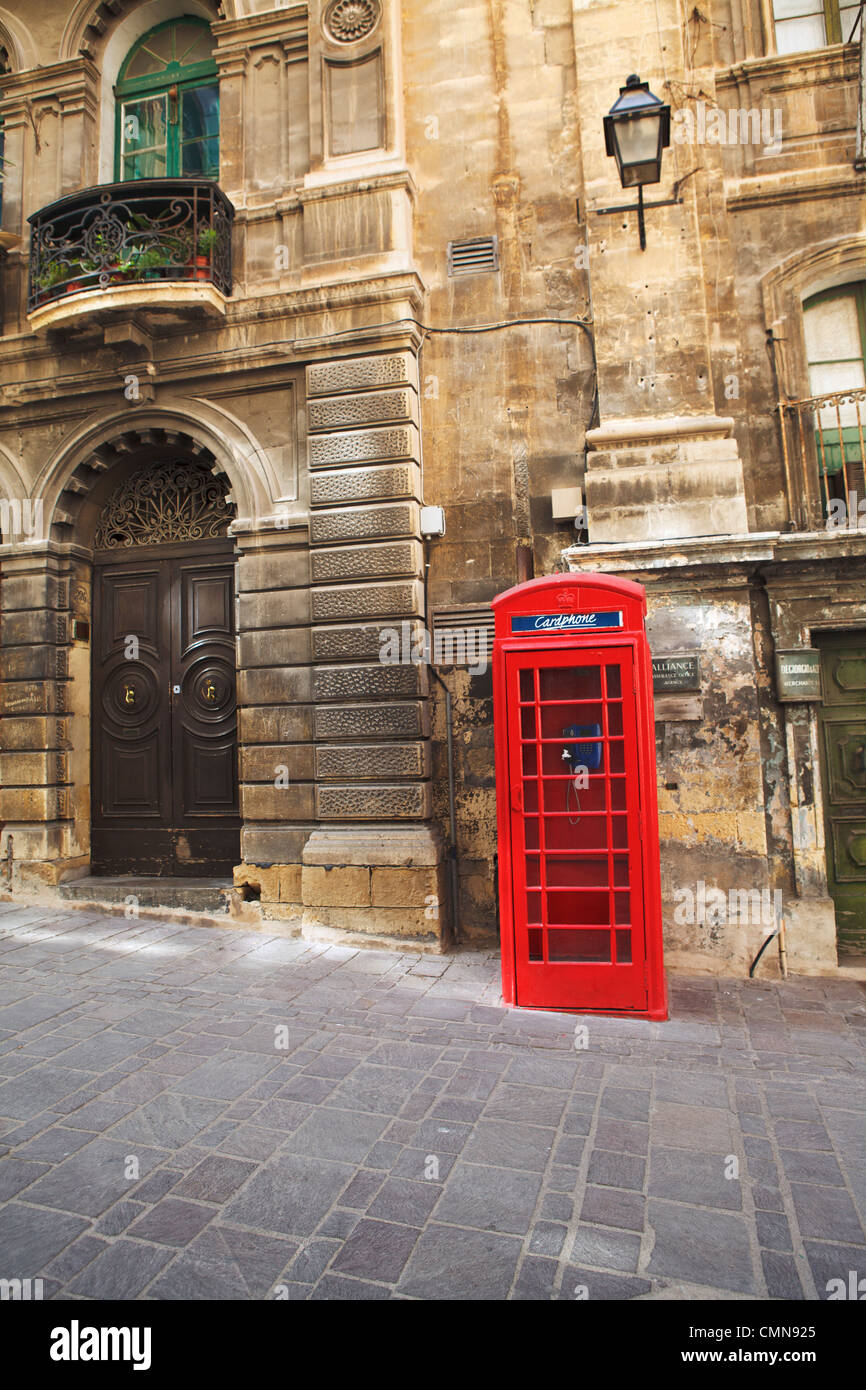 Red British Photnebox and Old Doorway in the Capital Valletta, Malta Stock Photo
