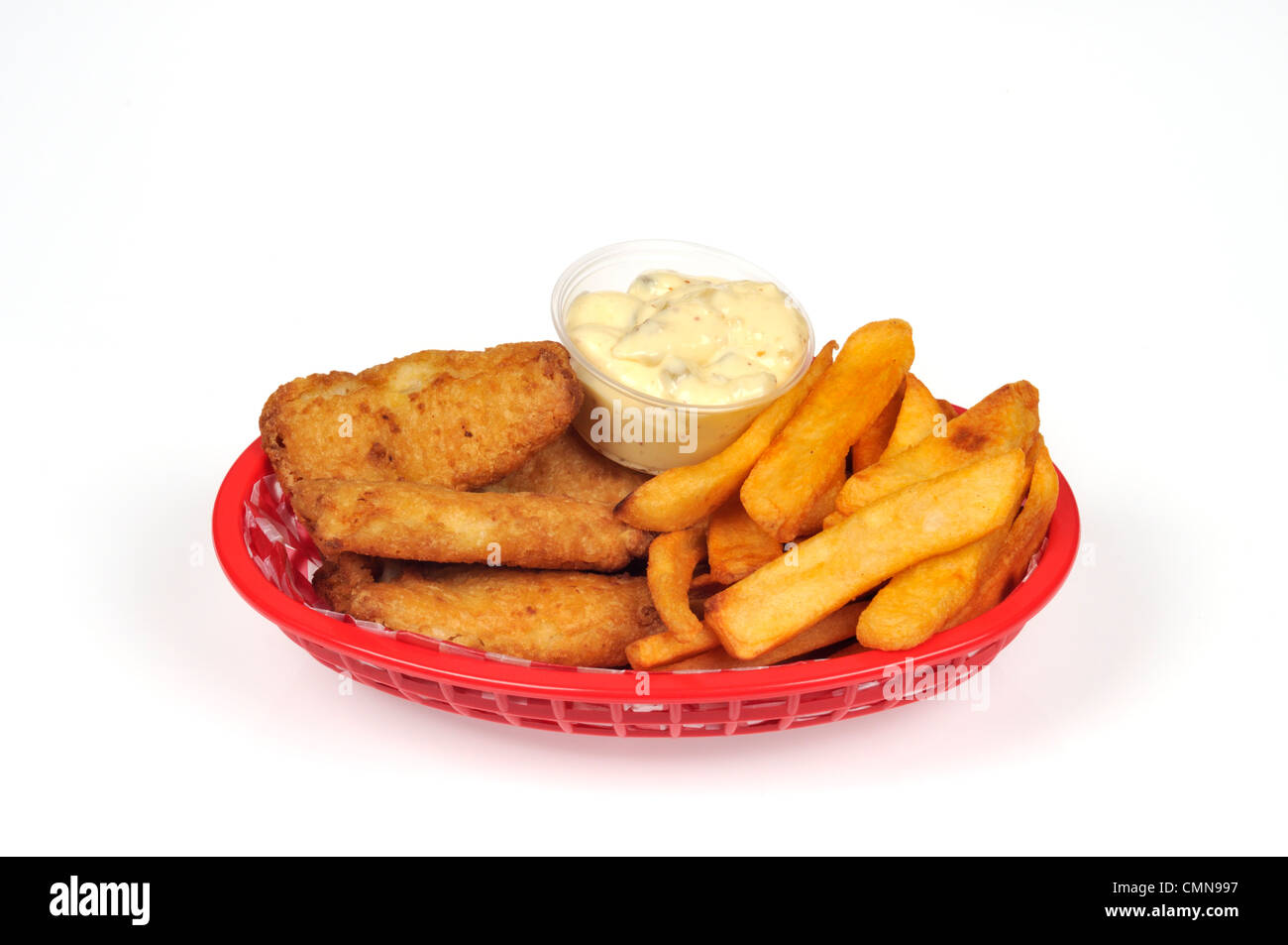 Basket of fish and chips with tartar sauce Stock Photo