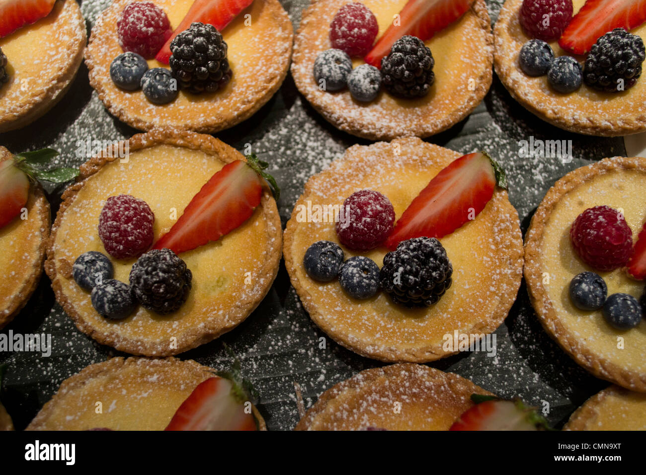 A plate of freshly-made fruit tarts Stock Photo