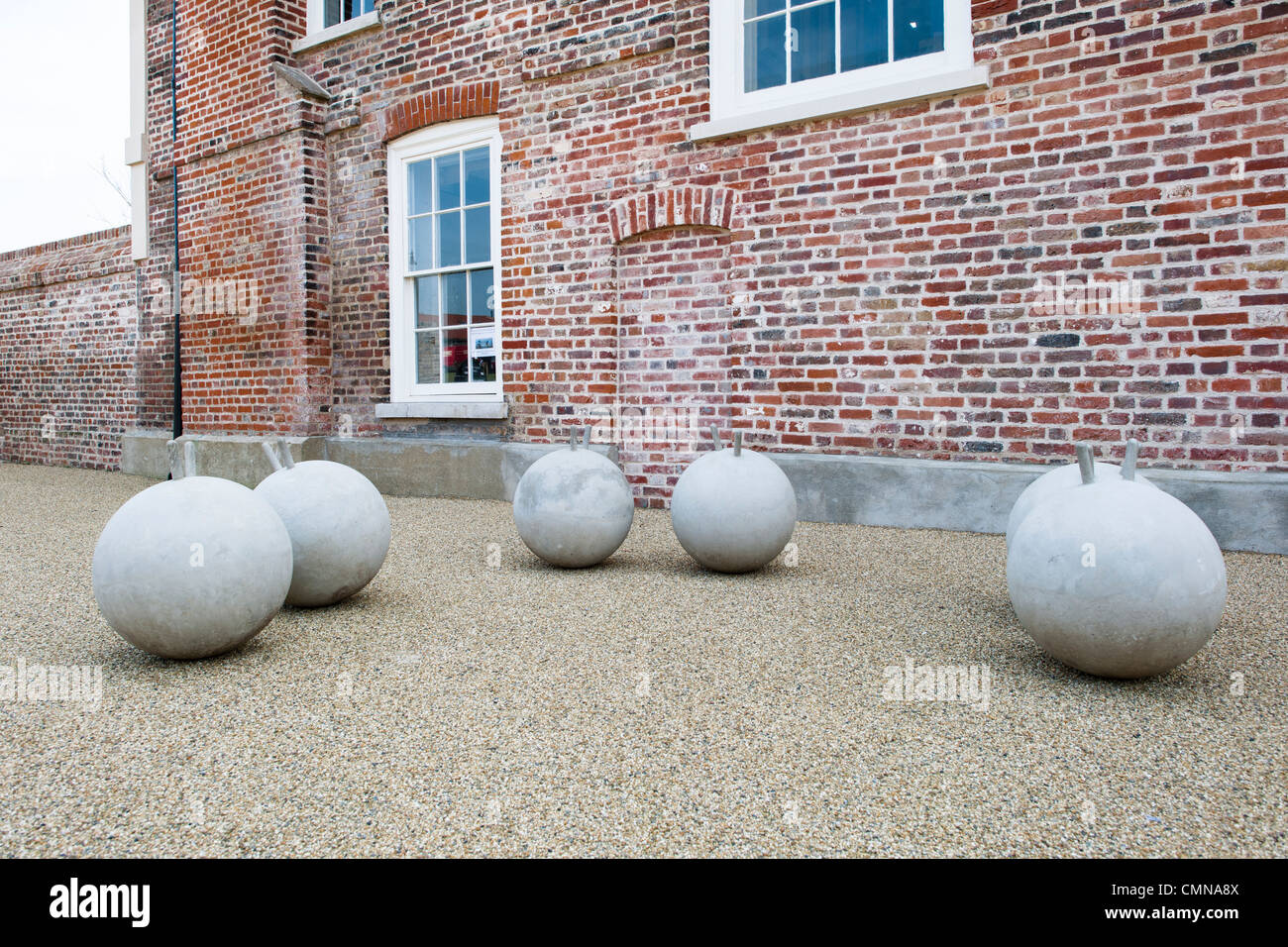 Art installation of cast concrete spheres called Antibodies,by Marcus Kleinfeld in courtyard of Royal Opera House site, Thurrock Stock Photo