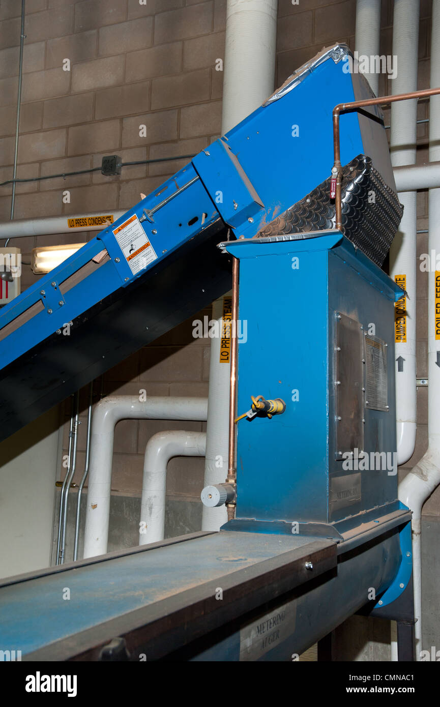 Automatic chip feeder used in a Biomass boiler in Darby, Montana Stock