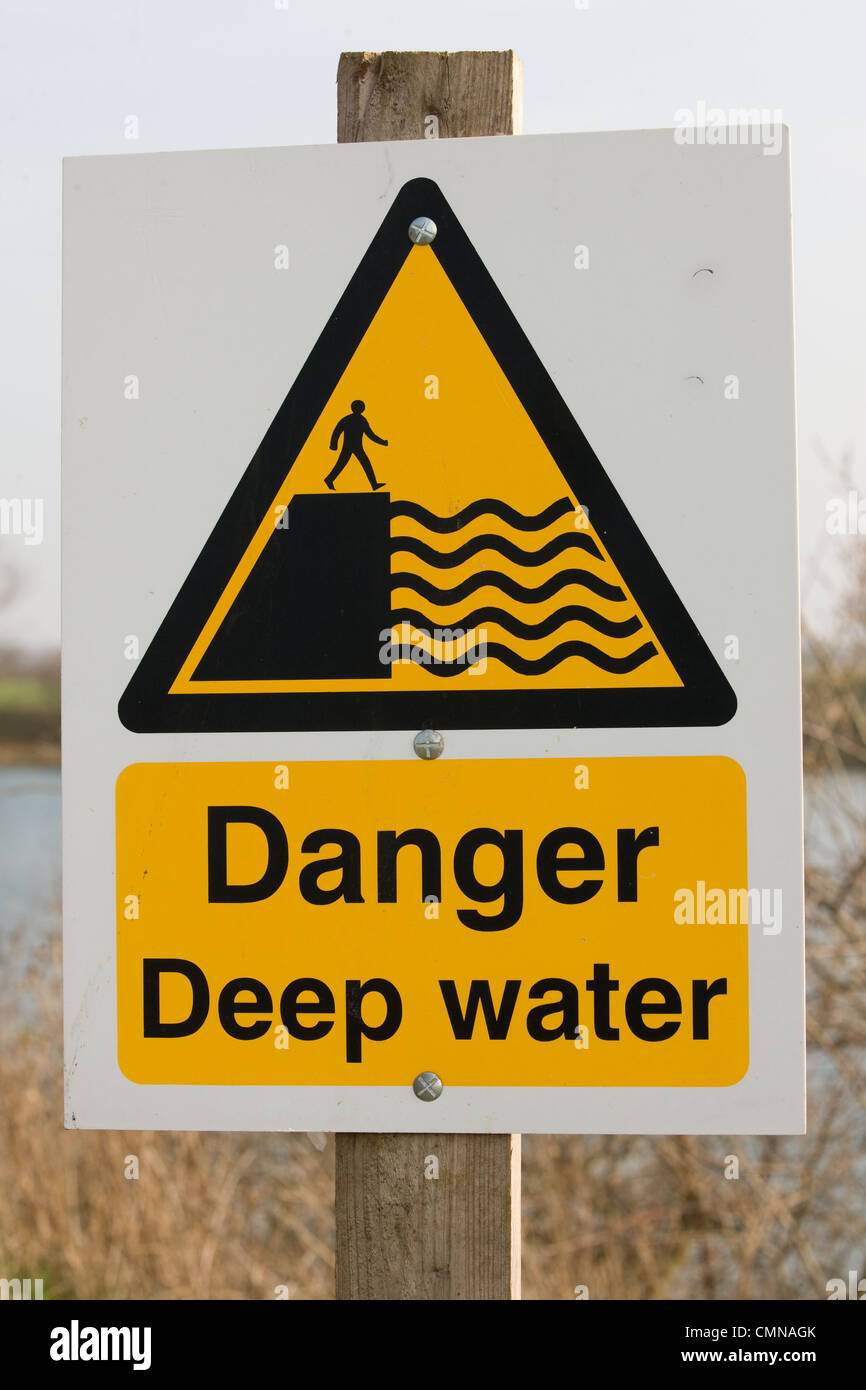 Danger Deep Water Warning Sign on a farm reservoir. Stock Photo