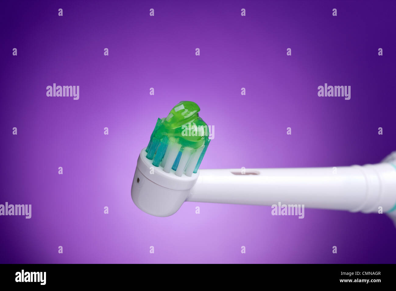 Electric toothbrush with green toothpaste Stock Photo Alamy