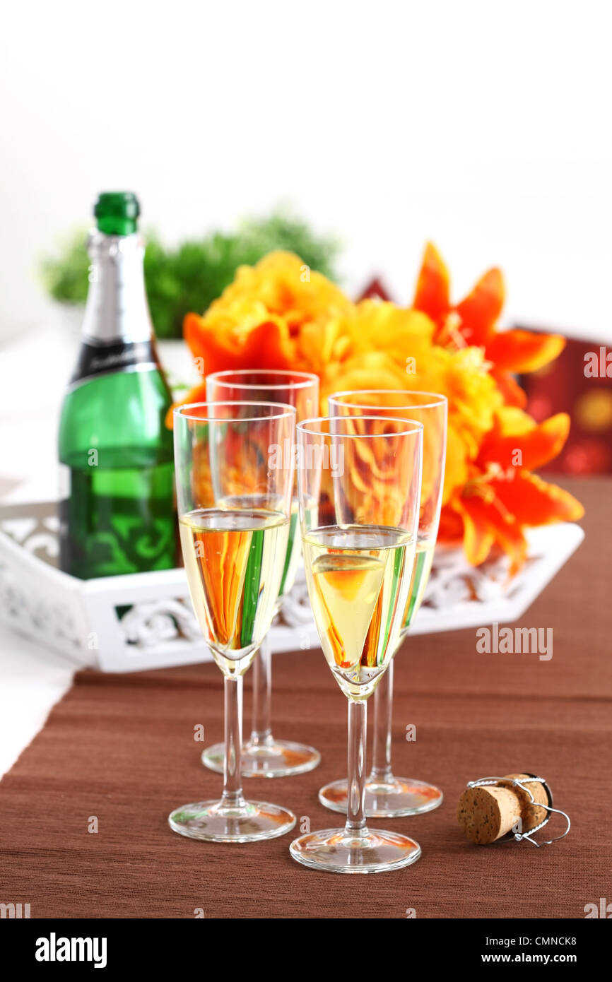 Sparkling wine with bouquet and wine bottle Stock Photo